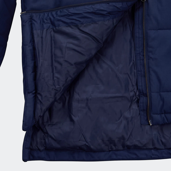 Close up view of the open dark blue Puma Mens Bench Jacket, showcasing its quilted interior lining and zipper details.