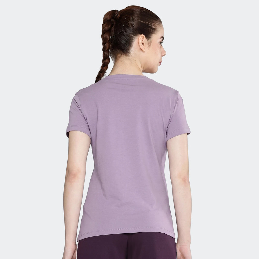 Female model from behind wearing a light purple Puma Power Hypernatural T-shirt with short sleeves and dark purple shorts,