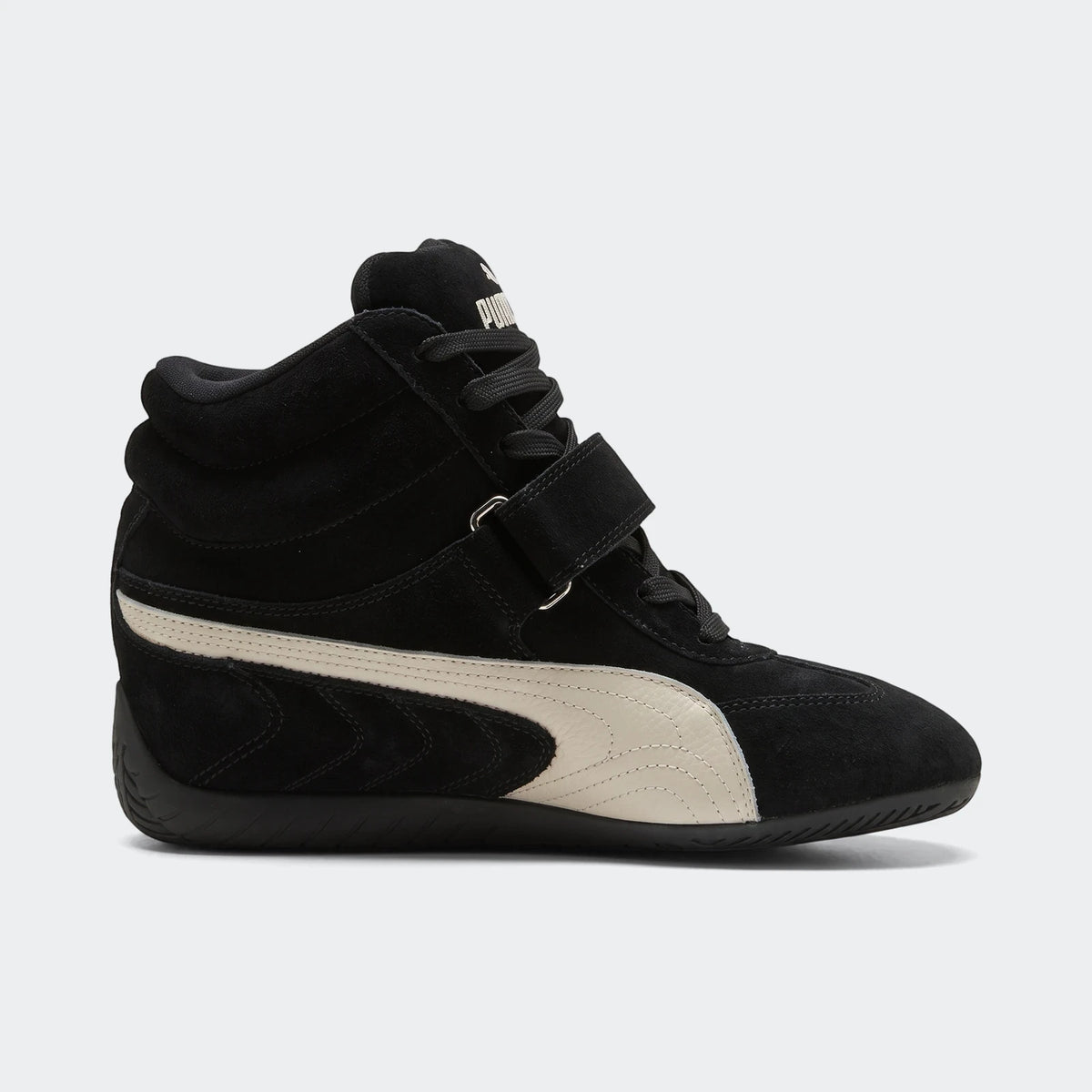 Black Puma Speedcat Wedge OG sneakers for women, featuring a high-top suede design with an off-white stripe and velcro strap.