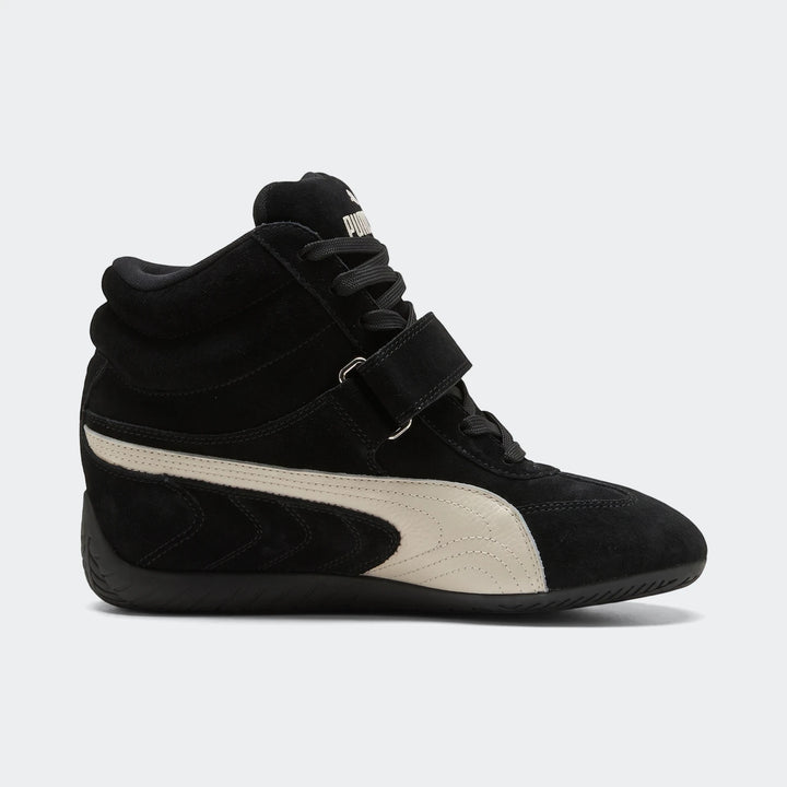 Black Puma Speedcat Wedge OG sneakers for women, featuring a high-top suede design with an off-white stripe and velcro strap.