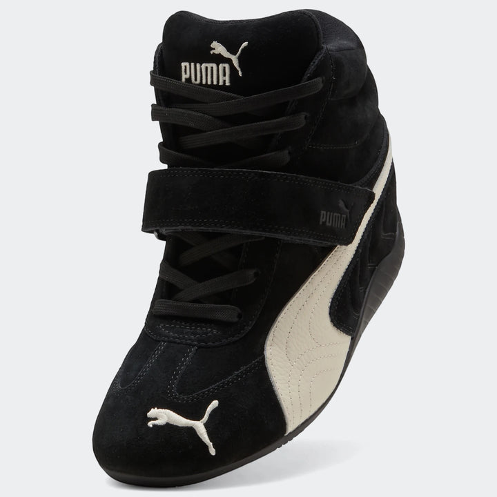 Black and white suede Puma Speedcat Wedge Og high-top sneakers for women, shown in a side view.