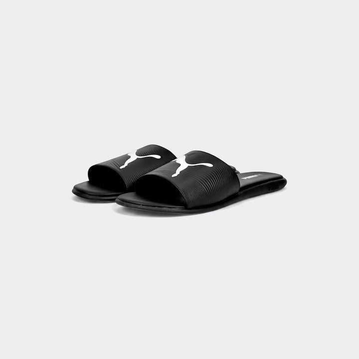 Black Puma Sporty Embossed 2.0 slides with white logo, shown from a slightly elevated side view.