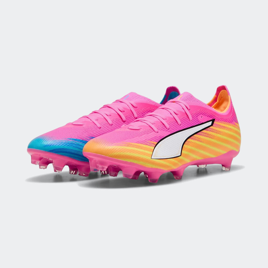 Pair of Puma Ultra 6 Match FG/AG unisex football boots in vibrant pink, blue, yellow, and orange with white branding.