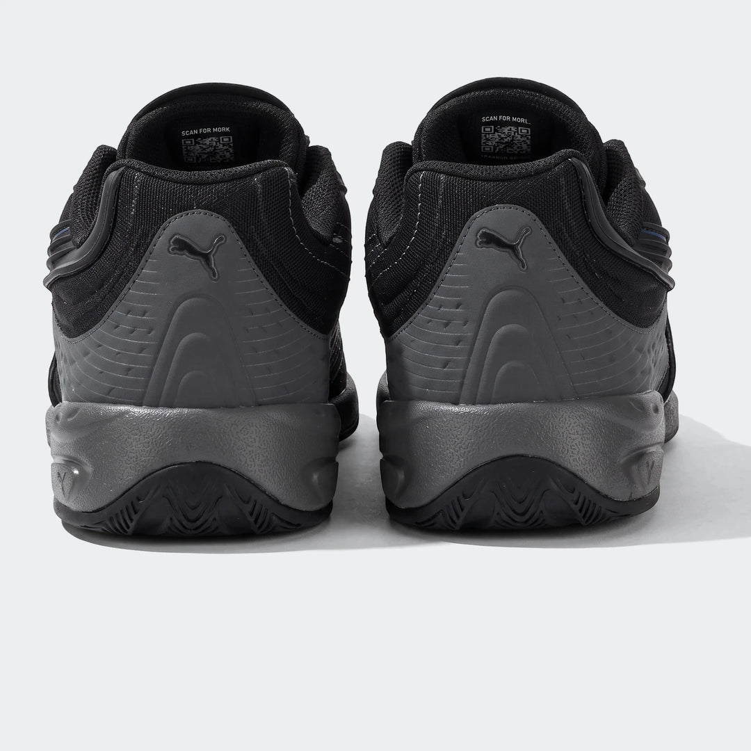 Rear view of Puma V-S2 Tactical sneakers in black and grey, featuring textured panels and Puma branding on the heel.