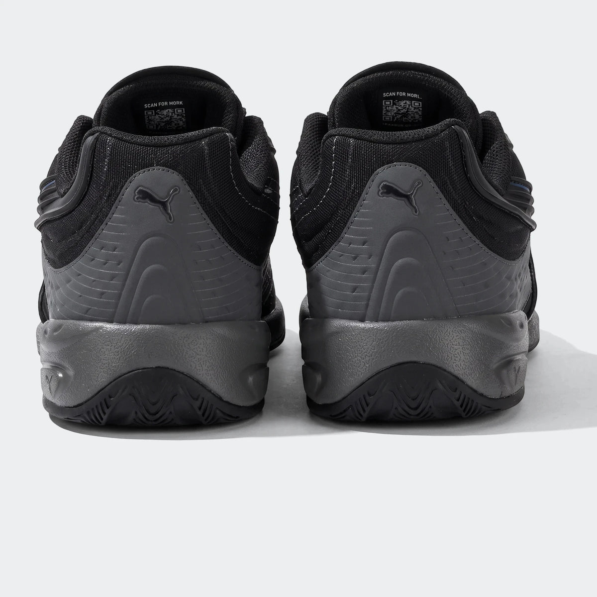 Rear view of Puma V-S2 Tactical sneakers in black and grey, featuring textured panels and Puma branding on the heel.