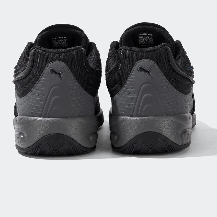 Rear view of Puma V-S2 Tactical sneakers in black and grey, featuring textured panels and Puma branding on the heel.