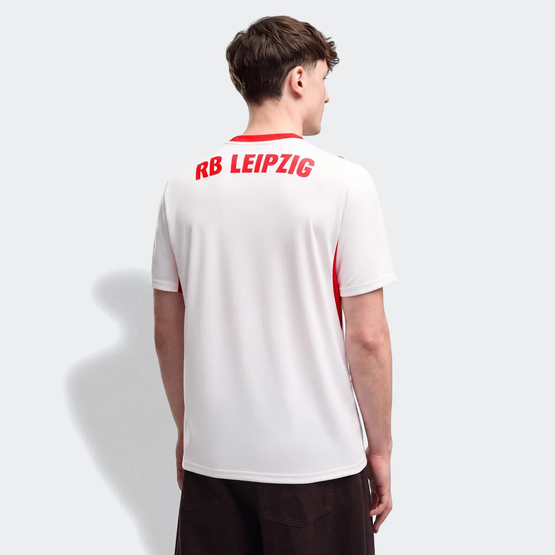 Back view of a man wearing the white Rb Leipzig 26/27 Home Jersey, featuring 'RB LEIPZIG' in red on the back.