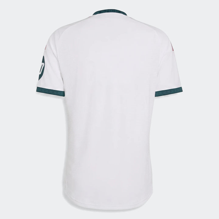 Real Madrid 25/26 Authentic Home Jersey, white with dark green collar and cuffs, shown from the back.