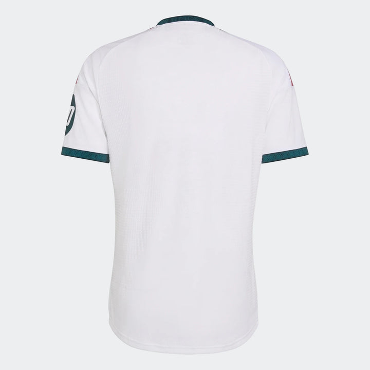 Back of a Real Madrid 25/26 Authentic Home Jersey in white with dark green collar and cuff trim, and subtle red accents.