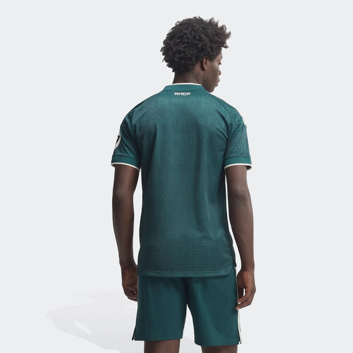 Back view of a male model wearing the Real Madrid 26/27 Away Authentic Jersey in dark green with a subtle pattern, white