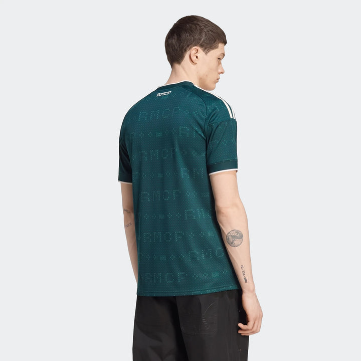 Male model wearing a dark teal Real Madrid 26/27 Away Jersey from the back, featuring white shoulder stripes and a textured