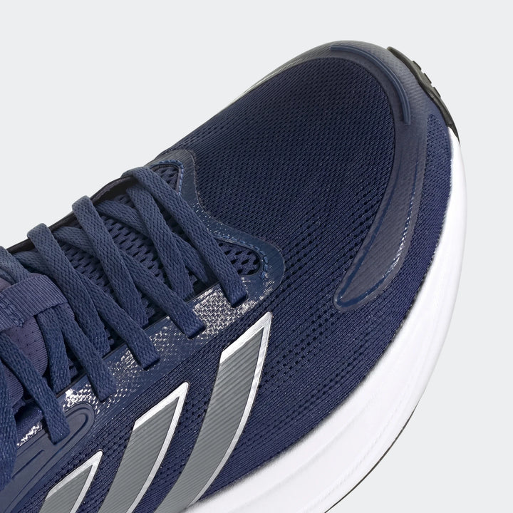 Close-up of a navy blue Response 2 running shoe featuring a mesh upper and distinct silver stripe detailing on the side.