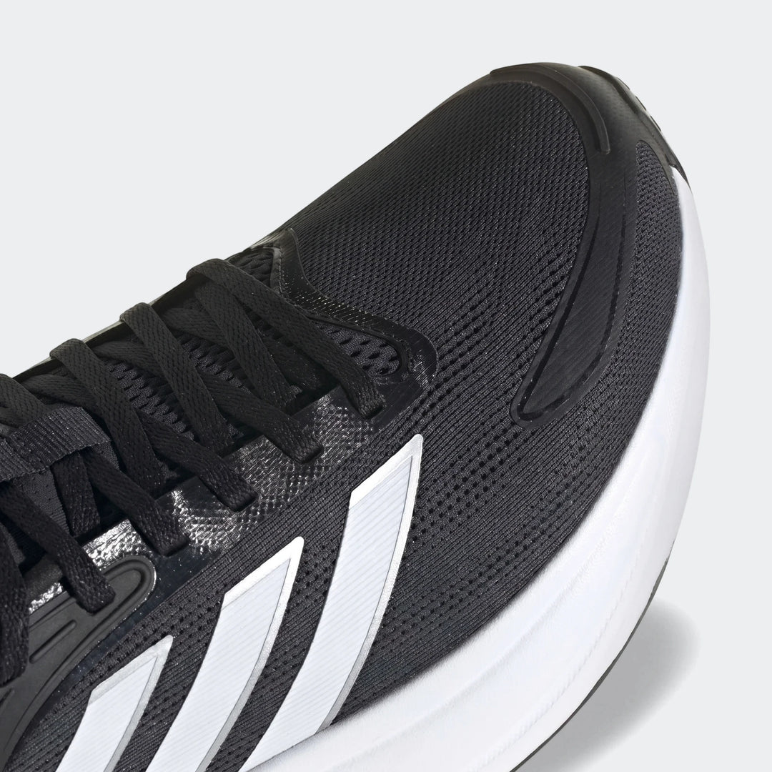 Close-up of Response 2 Running Shoes showing the black mesh upper, black laces, and white Adidas three-stripe logo on the