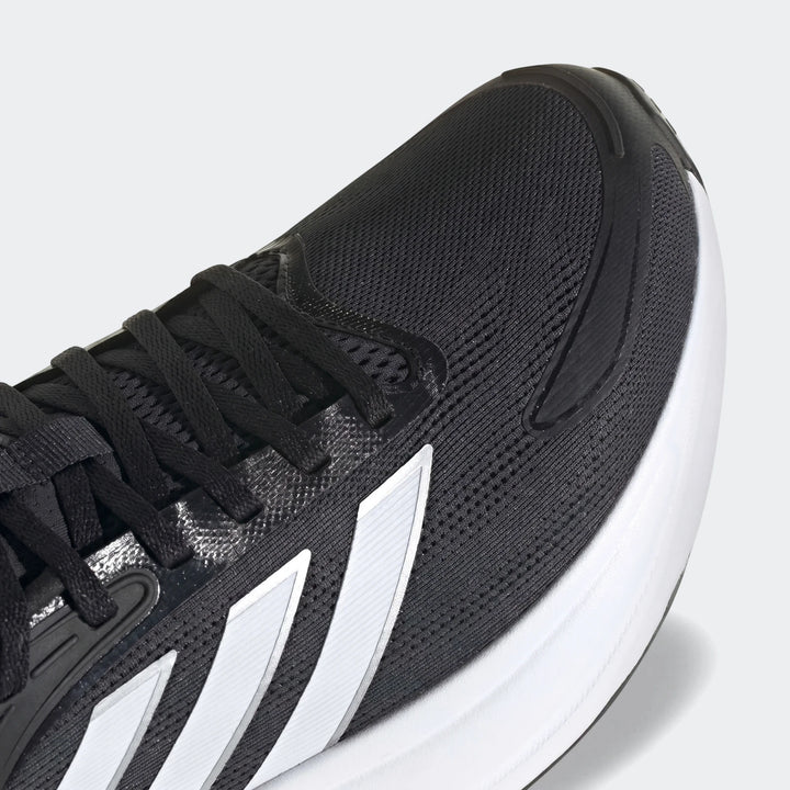 Close-up of Response 2 Running Shoes showing the black mesh upper, black laces, and white Adidas three-stripe logo on the