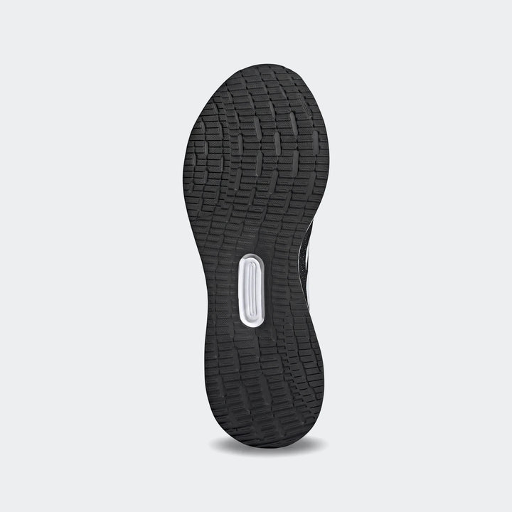 Bottom view of a black Runfalcon 5 sneaker sole, showcasing the detailed textured tread pattern and central white insert.