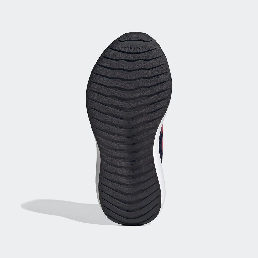 Underside view of a black textured non-marking sole of a Runfalcon 6 shoe, showing detailed grip patterns and white midsole.