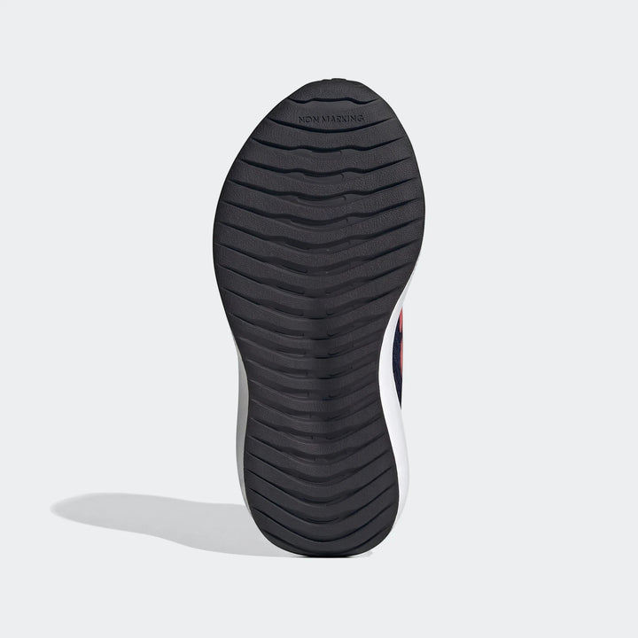 Underside view of a black textured non-marking sole of a Runfalcon 6 shoe, showing detailed grip patterns and white midsole.