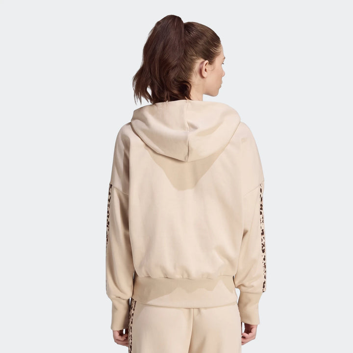 Back view of a woman wearing a beige Seasonal Essentials Animal Print 3-Stripes Full-Zip Hooded Track Top with a ponytail.