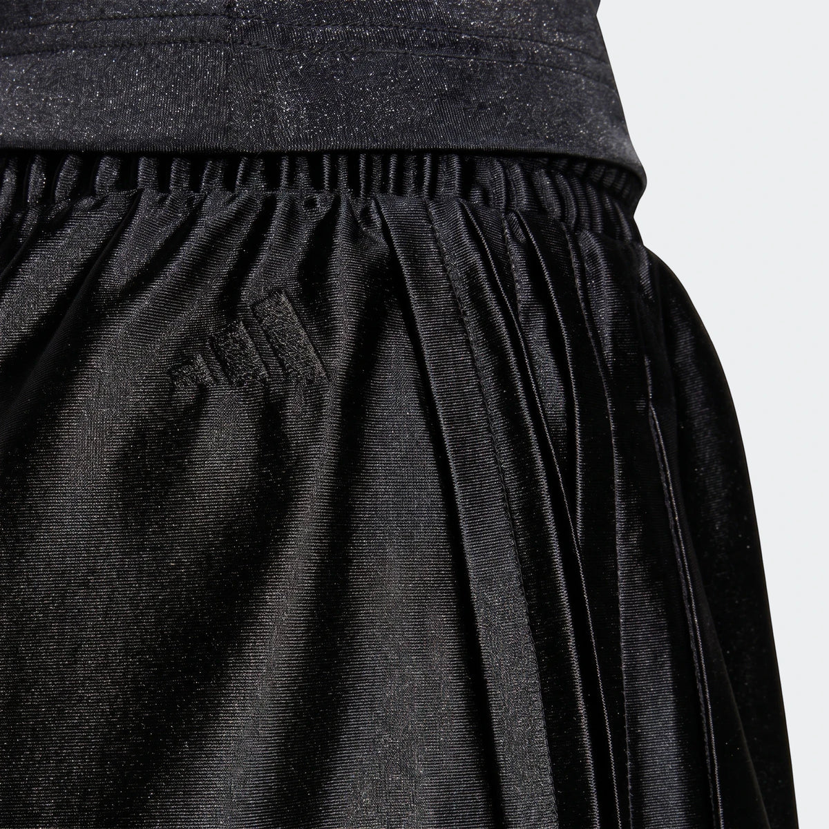 Close-up of black Seasonal Essentials Satin Shorts, showcasing the gathered fabric and elastic waistband.