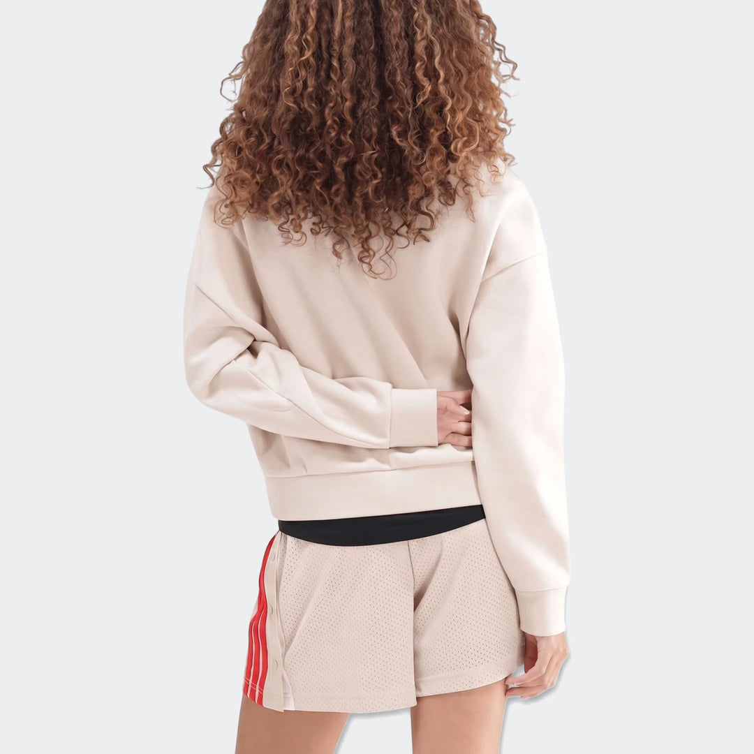 Beige Slim Fleece Crew Sweatshirt for women, paired with mesh shorts, seen from the back, highlighting curly hair.