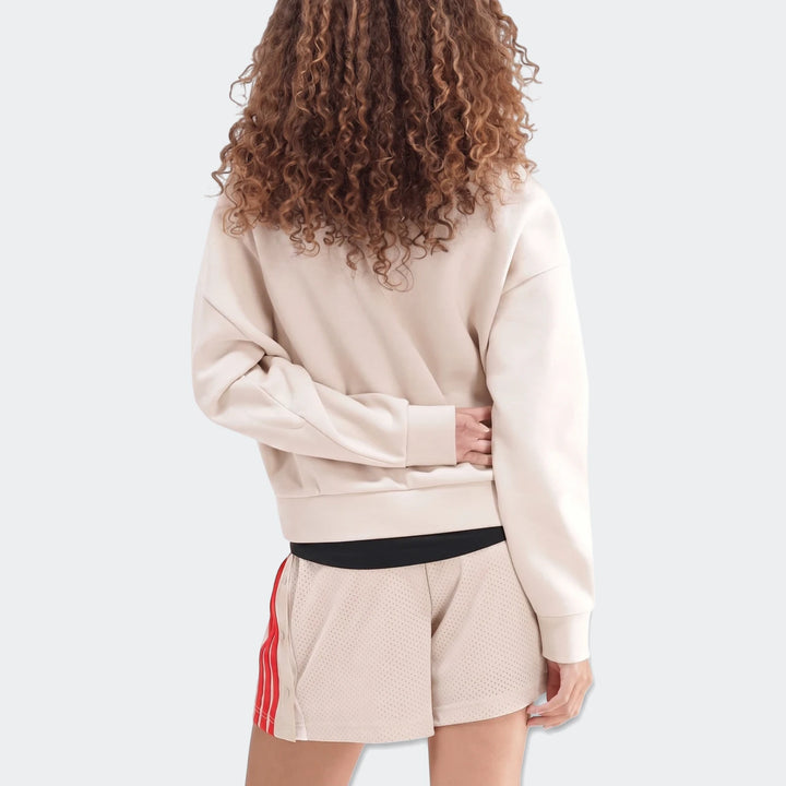 Beige Slim Fleece Crew Sweatshirt for women, paired with mesh shorts, seen from the back, highlighting curly hair.