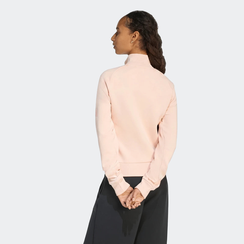 Light pink Soft Luxe Slim Track Top worn by a model from the back, showcasing the slim fit and high collar.