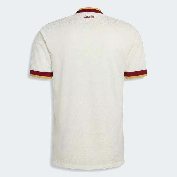 Back view of the Spain 25/26 Authentic Away Jersey, an off-white soccer jersey with red and gold trim.