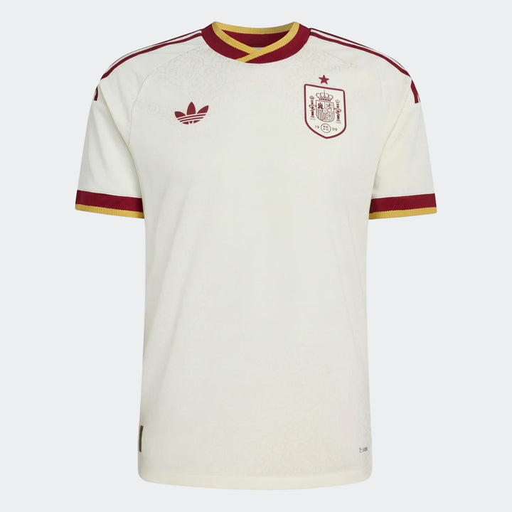 Front view of the off-white Spain 25/26 Authentic Away Jersey, featuring the Adidas logo and national team crest with red