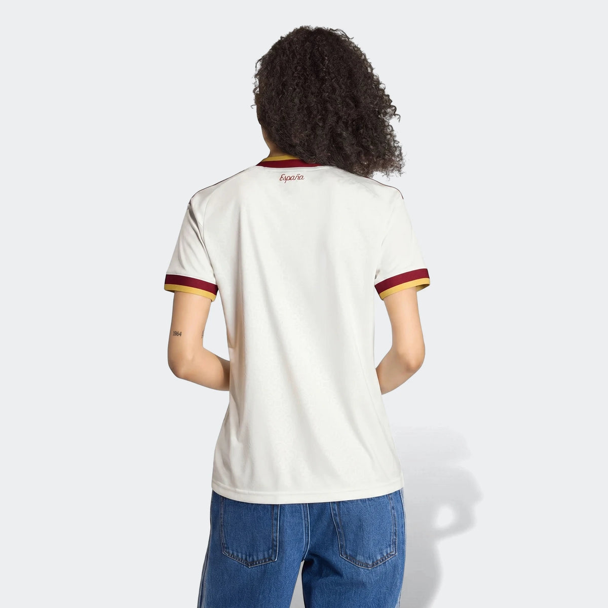 Spain 25/26 Away Jersey for women, featuring a white base with red and yellow accents, shown from the back.