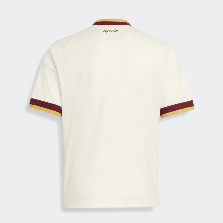 Back view of the youth Spain 25/26 Away Jersey in off-white with maroon and gold trim on the collar and sleeves.