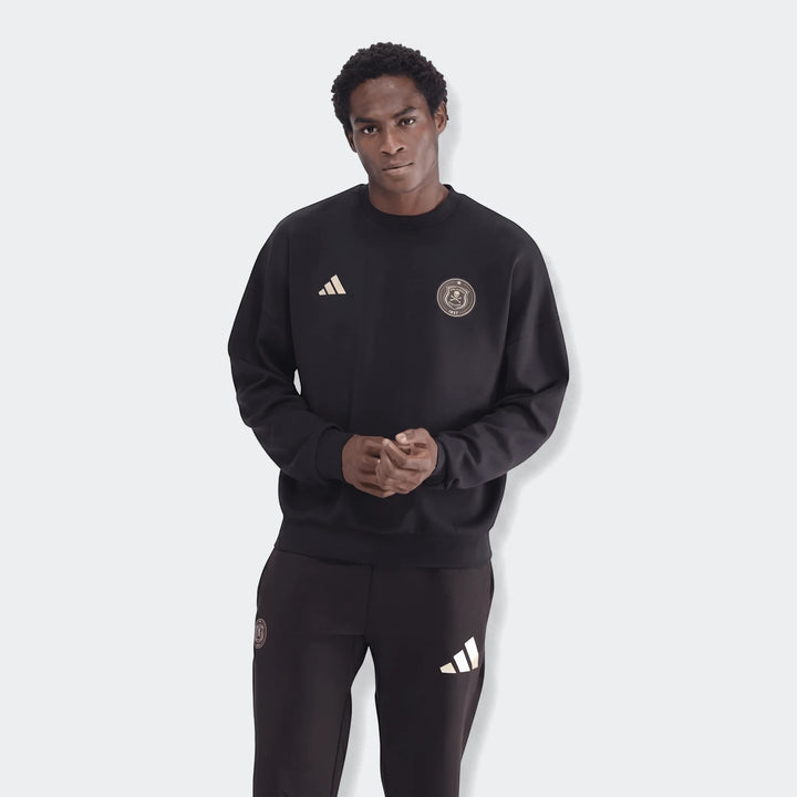 Male model wearing a black Adidas Sportswear Open Hem Future Icons 3-Bar Crew Sweatshirt and matching track pants, full body