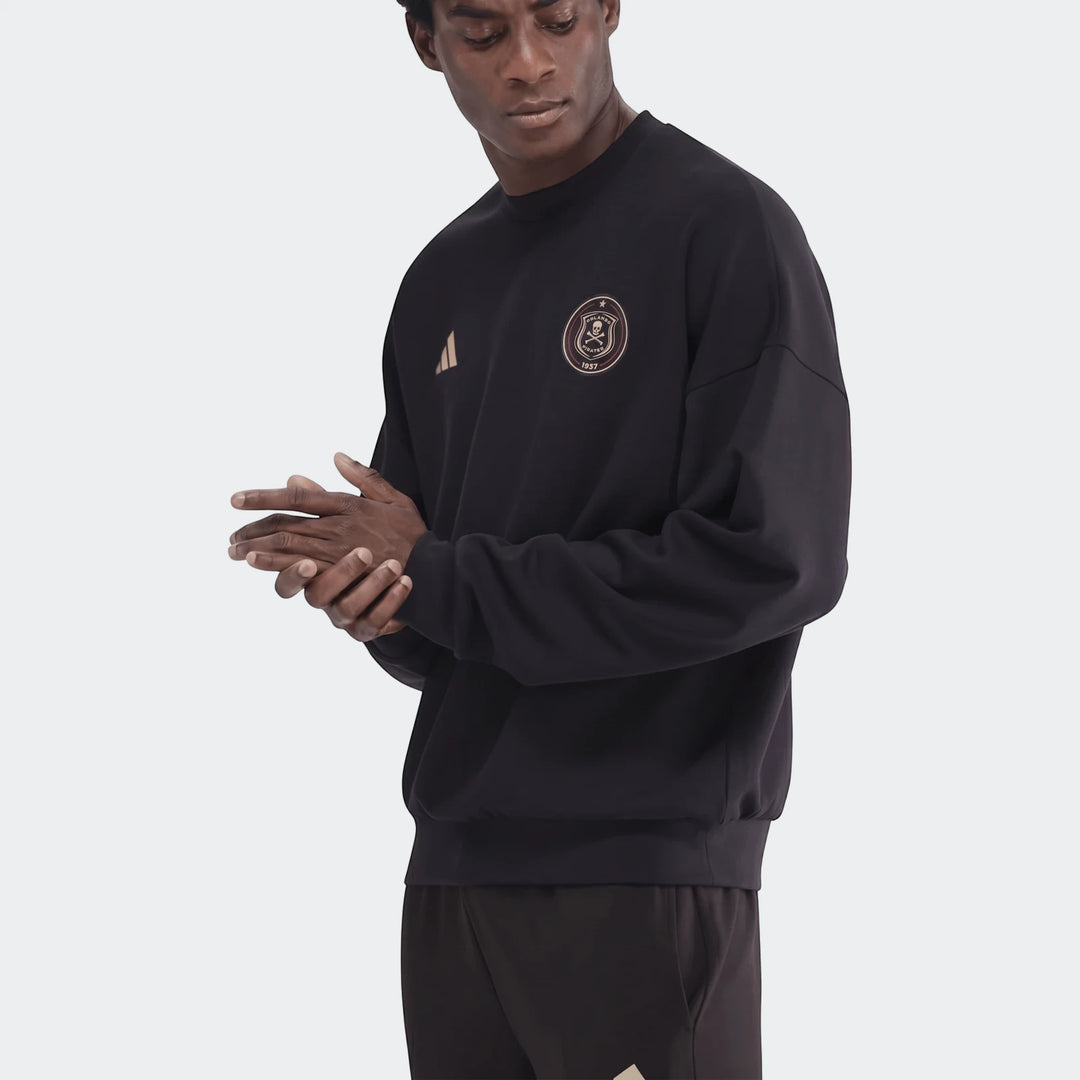 Male model wearing a black Sportswear Open Hem Future Icons 3-Bar Crew Sweatshirt, featuring an Orlando Pirates emblem and