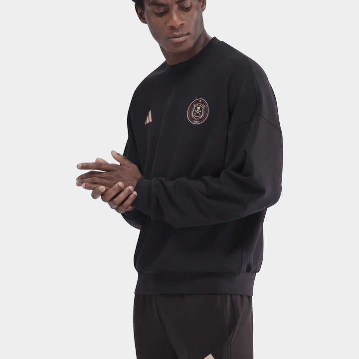 Male model wearing a black Sportswear Open Hem Future Icons 3-Bar Crew Sweatshirt, featuring an Orlando Pirates emblem and