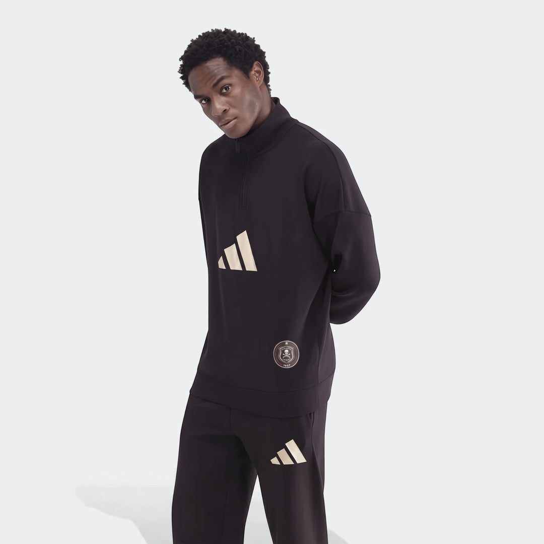 Male model wears a black Adidas Sportswear Open Hem Future Icons 3-Bar Half-Zip Sweatshirt and matching sweatpants.