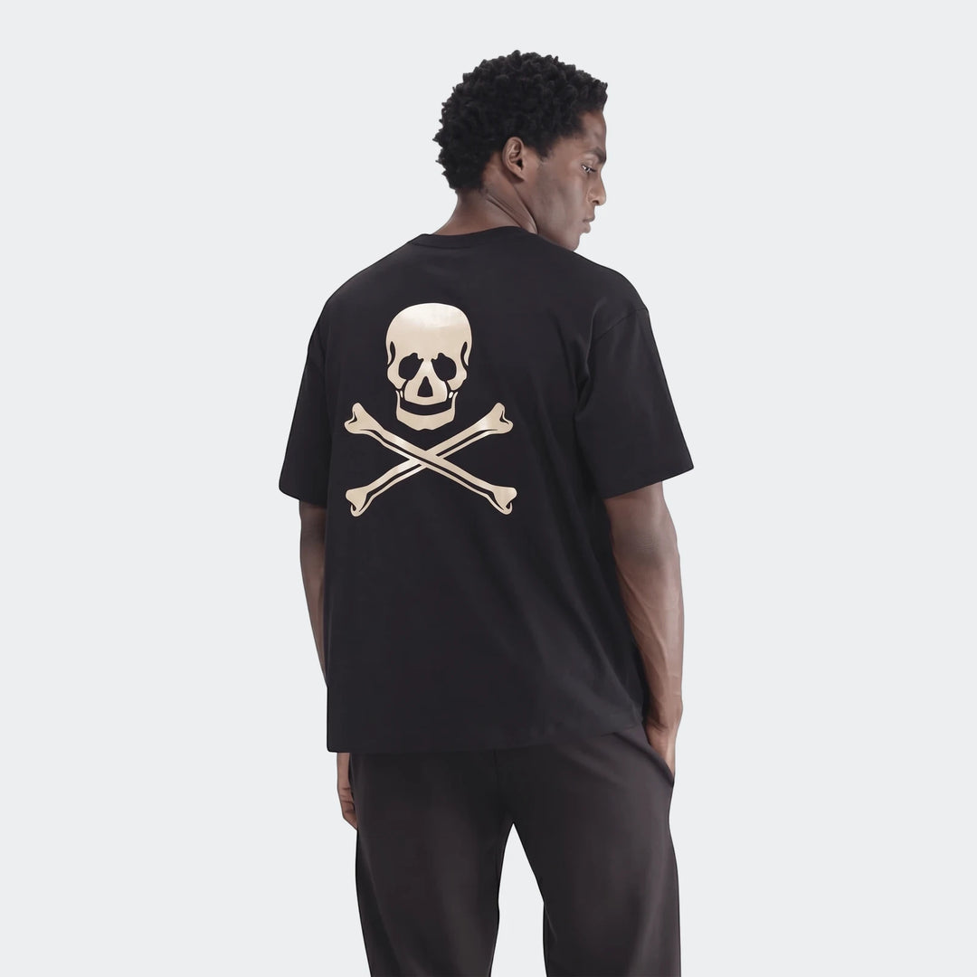 Black Sportswear Open Hem Single Jersey T-Shirt for men, featuring a beige skull and crossbones graphic on the back, worn by