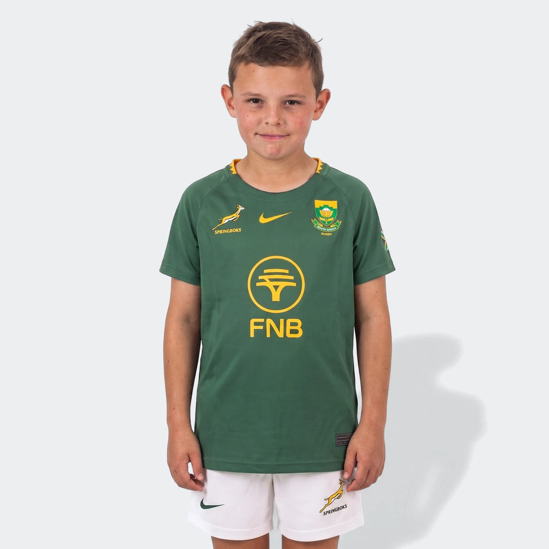 Spr Infnk Stdm Kit Hm Green Kits youth rugby home kit, front view green jersey with yellow crest and white shorts.