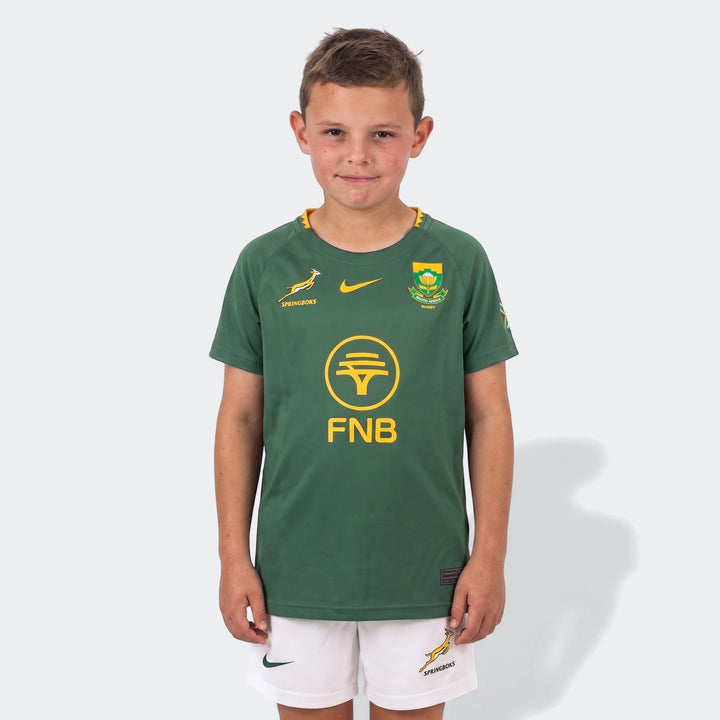 Spr Infnk Stdm Kit Hm Green Kits youth rugby home kit, front view green jersey with yellow crest and white shorts.