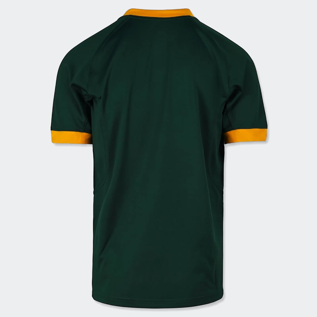 Back view of a dark green Spr Mnk Stdm Ss Jsy 7S Hm short-sleeved jersey, with orange and gold trim on collar and cuffs.