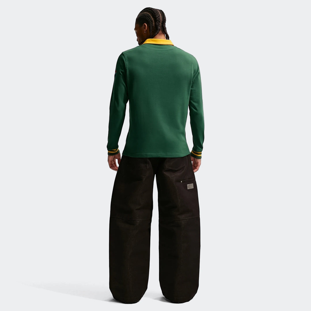 Men's Springboks Home Nike long-sleeve rugby jersey in dark green with a yellow collar, worn by a model from the back.