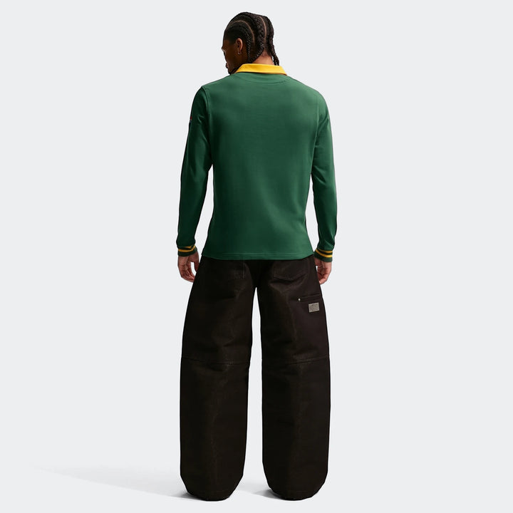 Men's Springboks Home Nike long-sleeve rugby jersey in dark green with a yellow collar, worn by a model from the back.