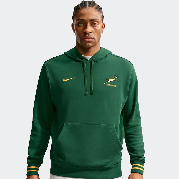 Green Springboks Men's Nike hoodie with the Springboks logo and yellow striped cuffs, modeled by a man.