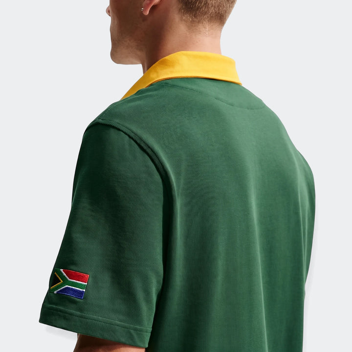 Back view of a Springboks Men'S Rugby Home Short-Sleeve Jersey in green with a yellow collar and South African flag patch.