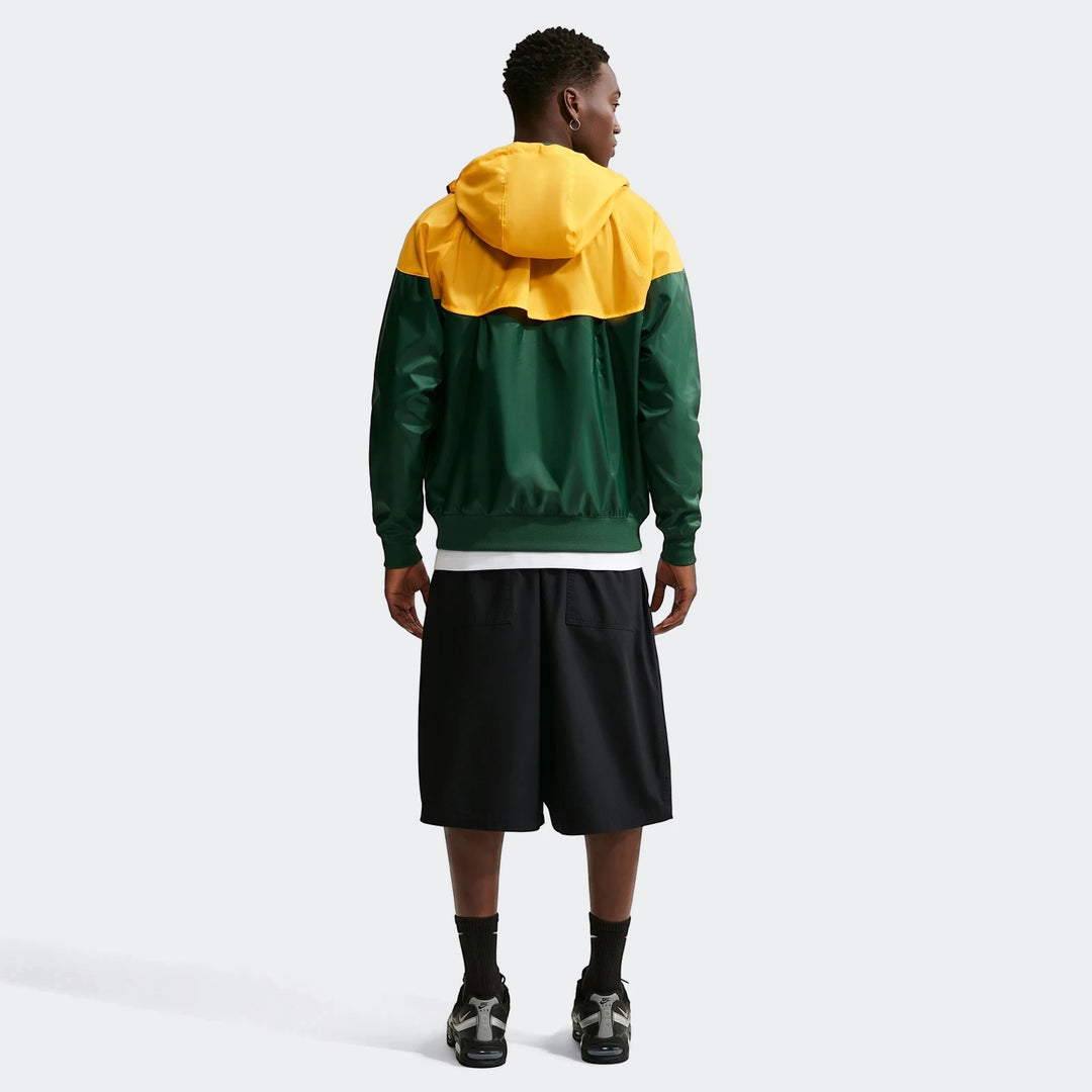 Springboks Nike Windrunner jacket in yellow and green, worn by a male model from the back, showcasing its design.