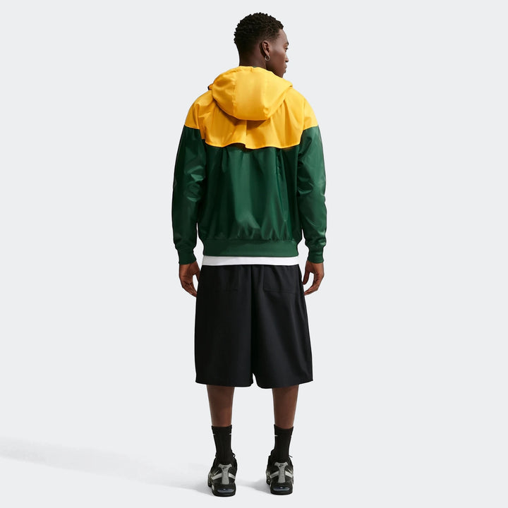 Springboks Nike Windrunner jacket in yellow and green, worn by a male model from the back, showcasing its design.