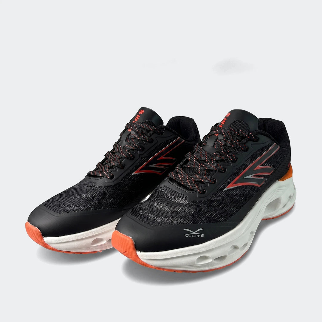 A pair of Stelio Black/Orange Sneakers featuring black mesh, orange accents, white sculpted soles, and black and orange