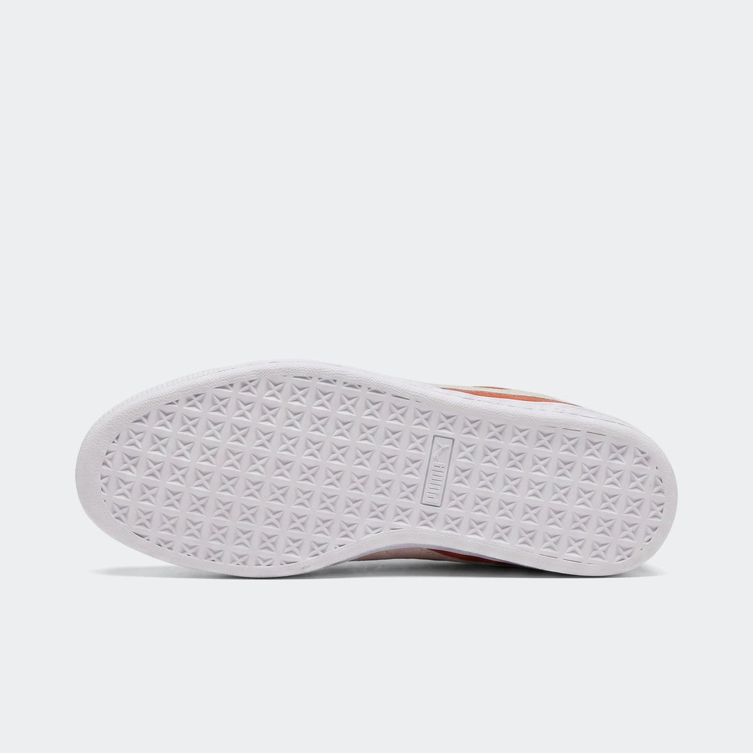 Bottom view of a Suede Classic Cayenne Pepper/White sneaker, showcasing its textured white rubber sole with visible branding.