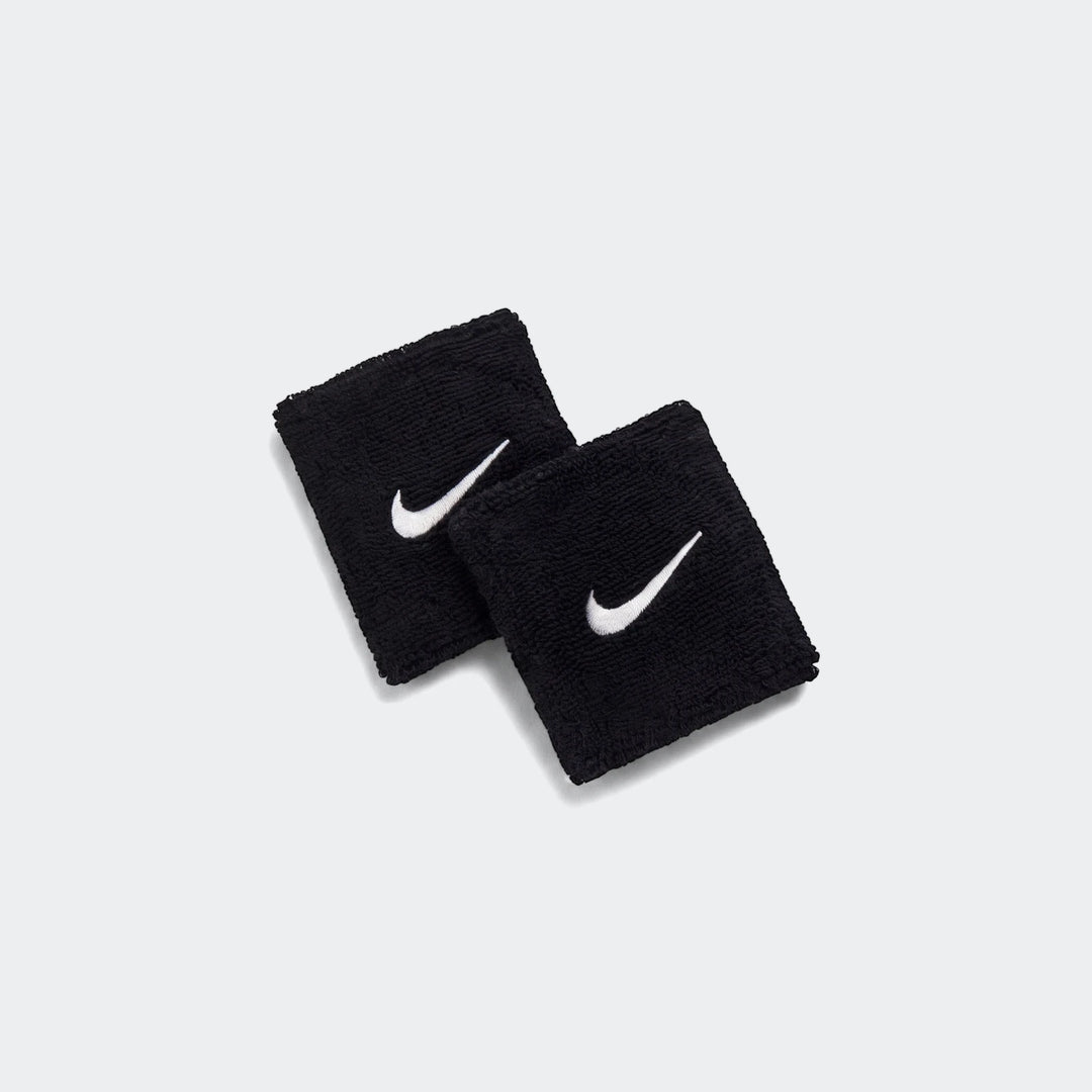 A pair of black Nike Swoosh Classic Wr terry cloth wristbands, each featuring a white embroidered Nike swoosh logo,