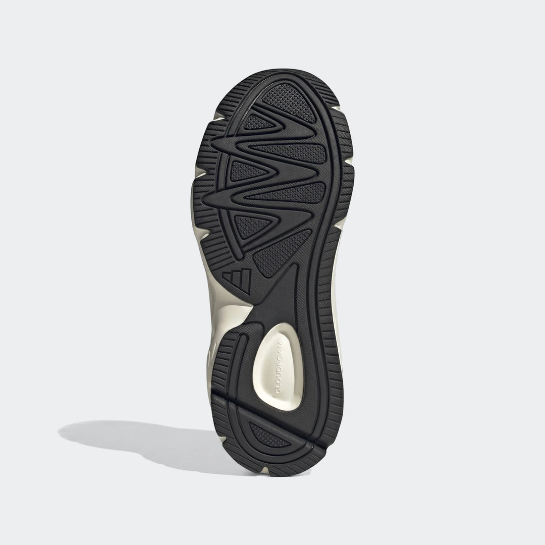 Underside view of Adidas Technochaos 2000 Shoes, featuring a black rubber sole with deep tread patterns and CLOUDFOAM