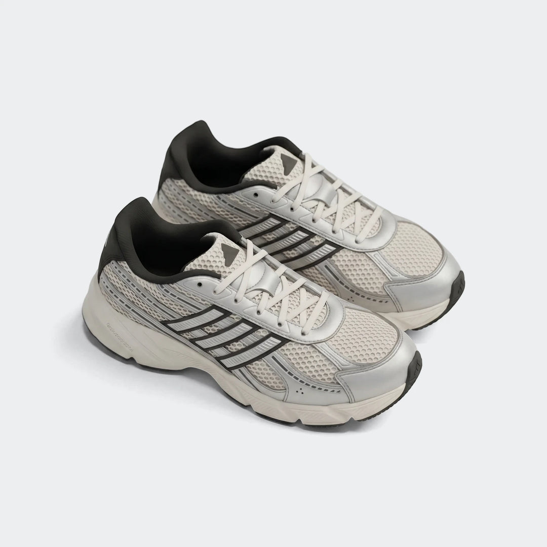 Technochaos 2000 shoes in white and silver mesh with black collar, lace-up low-top sneakers, side view.