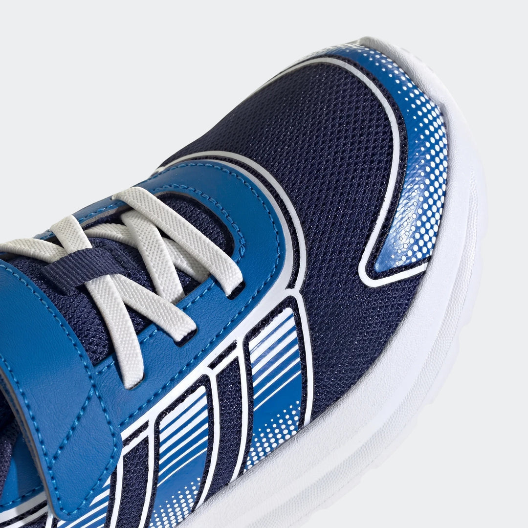 Close-up front view of children's blue and navy Tensaur Run 4.0 athletic shoes with white laces and striped detailing.